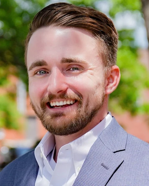 Tim Gibson wearing a blue blazer outdoors
